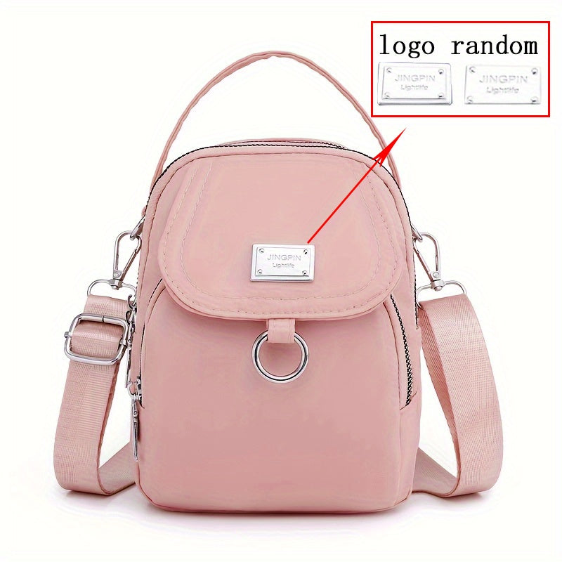 Ayollar uchun nylon crossbody sumka, katta sig'imli, bir rangli, zip yopilishi, polyester astarli, kundalik foydalanish va maxsus tadbirlar uchun ko'p funksiyali, qizil yoki qora ranglarda mavjud.