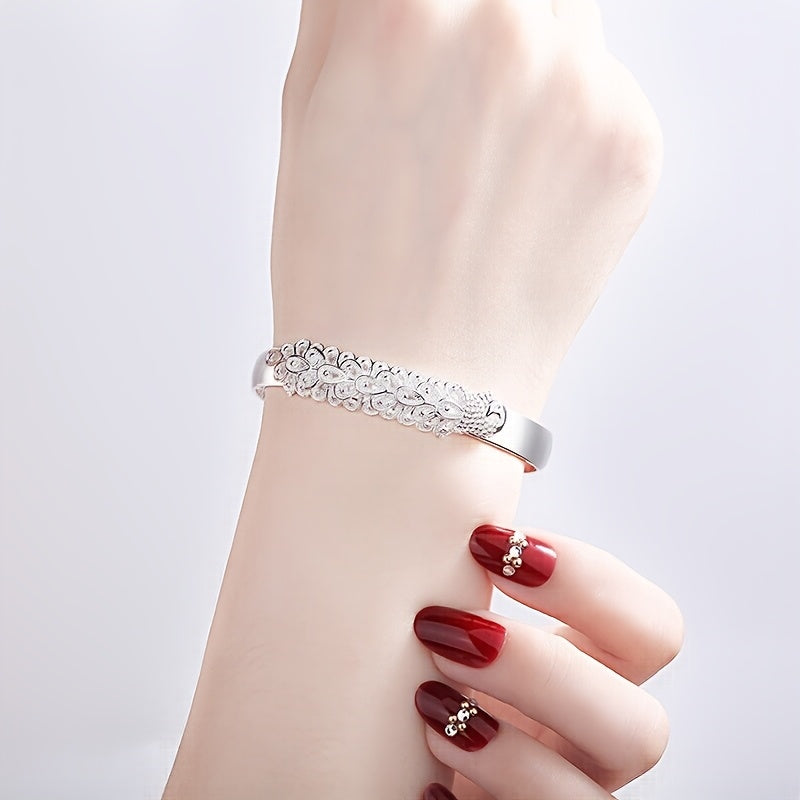 Women’s Ethnic-Inspired Bracelet with Peacock Feather Silk Opening and Phoenix Design