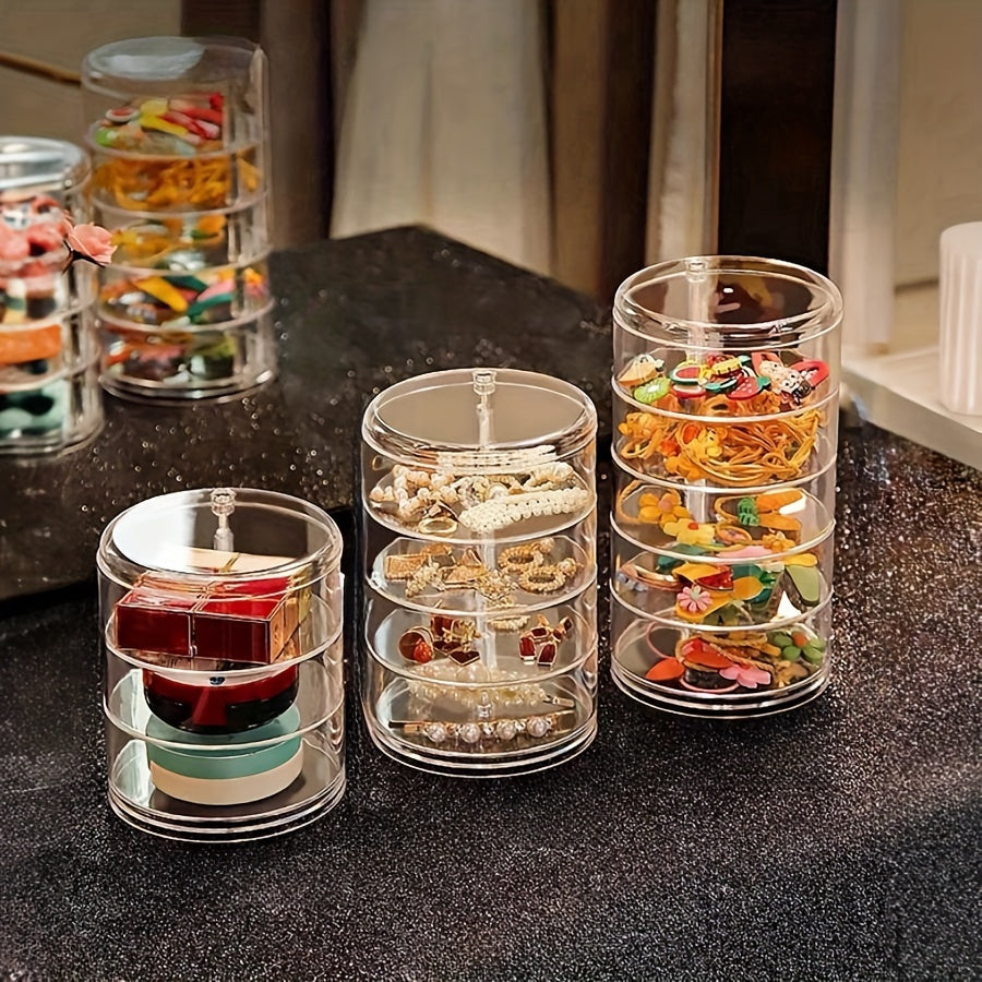 Aylanuvchi zargarlik va makiyaj saqlash qutisi, bilakuzuklar va sirg'alar uchun dumaloq plastik tashkilotchisi bilan. Buni uy, oshxona, hammom yoki yotoqxona uchun estetik xona bezaklari sifatida ko'rsatish stendi sifatida ishlatish mumkin.