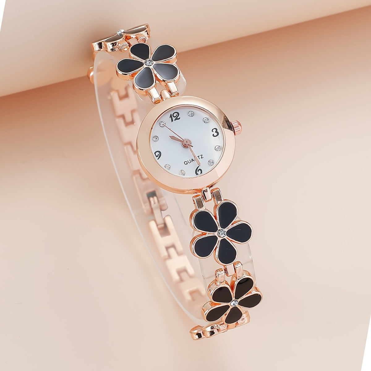 Reloj de cuarzo para mujer con detalles de rhinestone y banda de aleación de zinc con patrón de flor de ciruelo