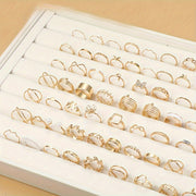 Ayollar uchun gullar, kapalaklar va yurak shaklidagi dizaynlarga ega 66 ta moda uzuklar to'plami