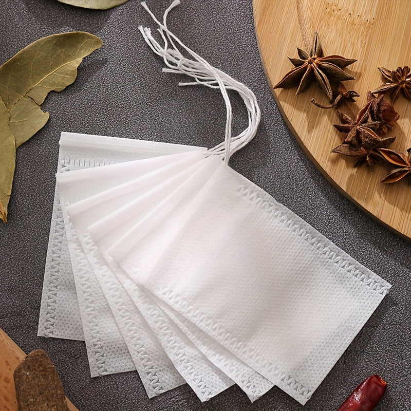 10 yoki 20 dona tortish qopqog'i bilan bir martalik choy filtr sumkalari, choy va ziravorlarni tayyorlash uchun to'qilmagan matodan tayyorlangan