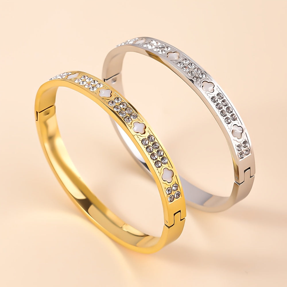 Zamonaviy zanglamas po'latdan yasalgan bangle bilaguzuk, porloq to'rt yaproqli qovoq dizayni bilan - oltin va kumush ranglarda mavjud, har kuni kiyish yoki o'ylangan sovg'a sifatida mukammal.