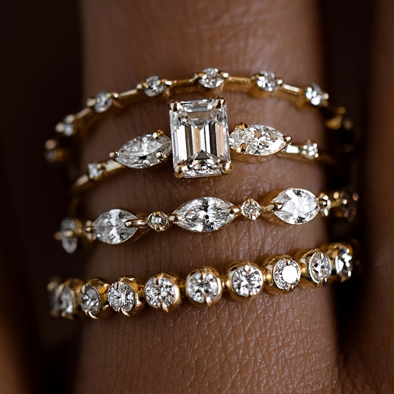 Ayollar uchun mo'ljallangan to'rt ta'sirli oltin kubik zirkoniy stacking uzuklar to'plami, nafis va hashamatli uslubni taklif etadi. Ular to'y, yubileylar va kundalik yoki bayram kiyimlari uchun mukammaldir.