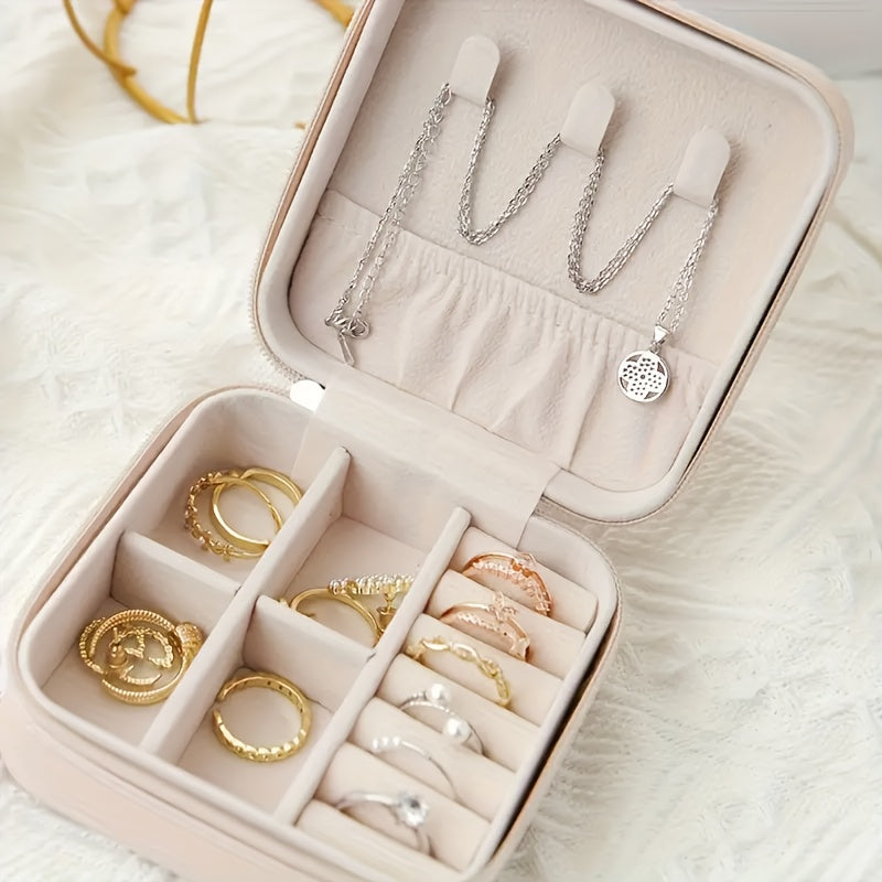 Organizador de joyas de cuero con cierre de cremallera y compartimentos forrados de tela