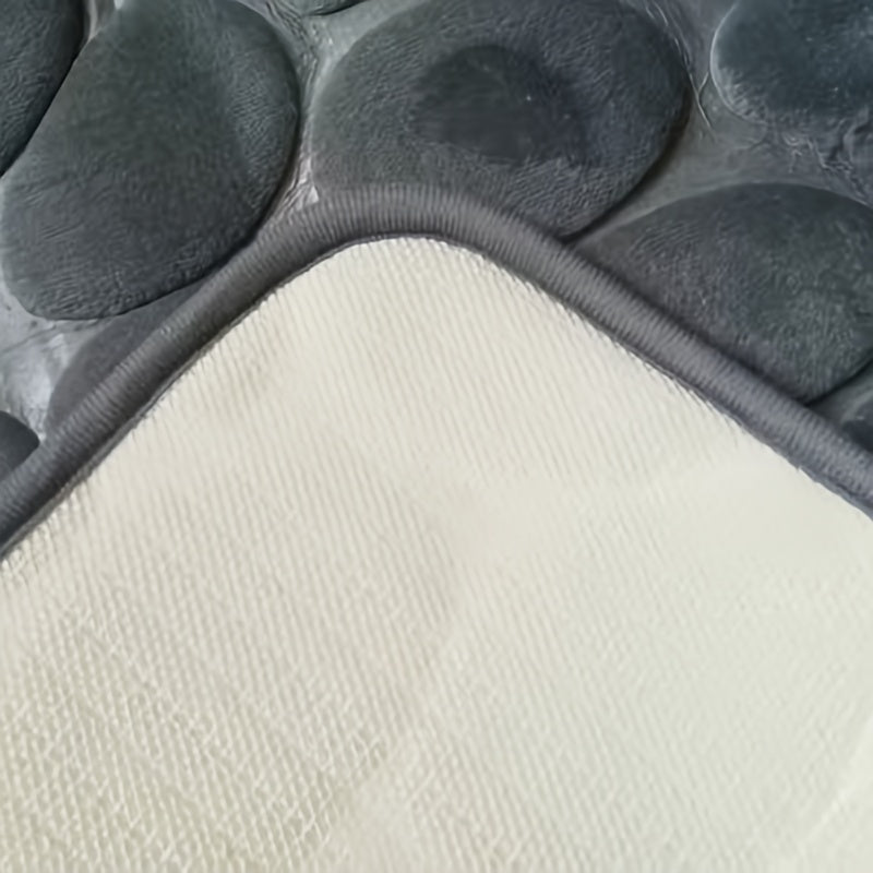 Мягкий коврик для ванной из мемори-фоама с рельефным дизайном в виде булыжников из кораллового флиса, идеален для декора ванной и релаксации, а также для использования в других зонах, таких как кухня, спальня и душ.