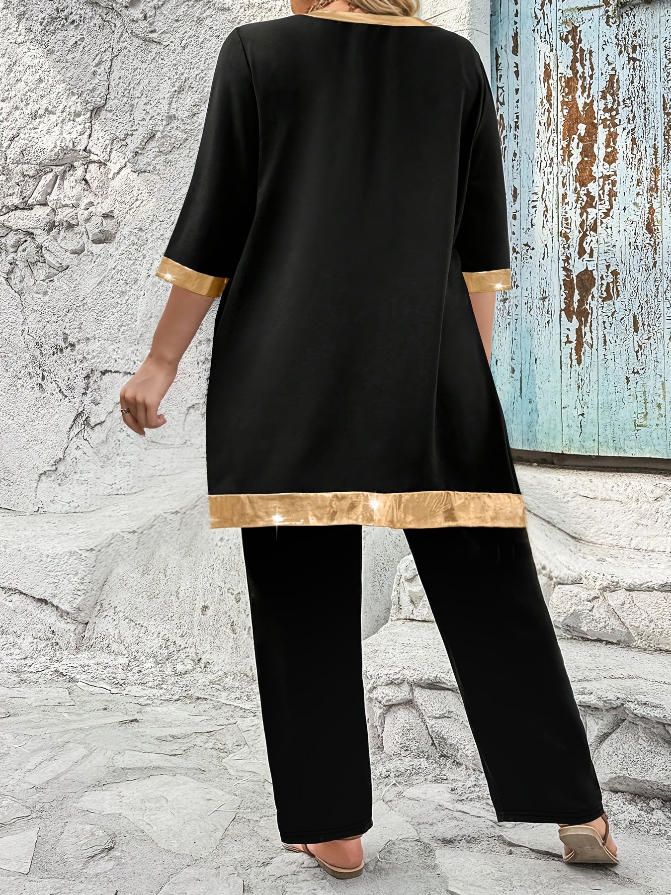 Asimmetrik hemli yuqori va bir rangli shimlar katta o'lchamdagi ikki qismli to'plam.