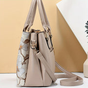 Стильная сумка-тоут с цветочным принтом для женщин с 3-слойным дизайном, карманами, застежкой на молнии и прочным PU-материалом в цветах хаки, кремовом, зеленом, синем, черном.