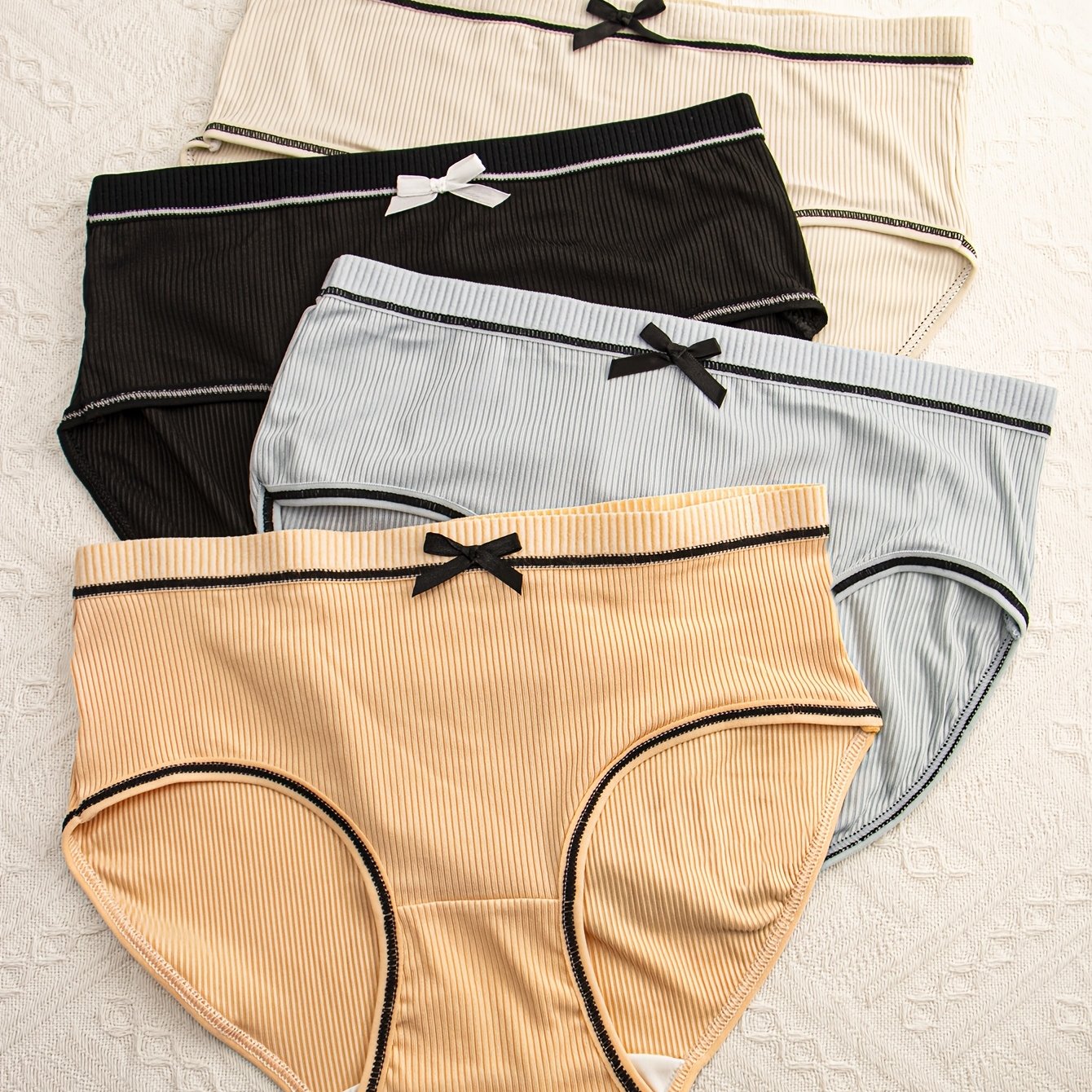 Pack de 4 braguitas de punto transpirable con ribete y diseño de triángulo para mujer