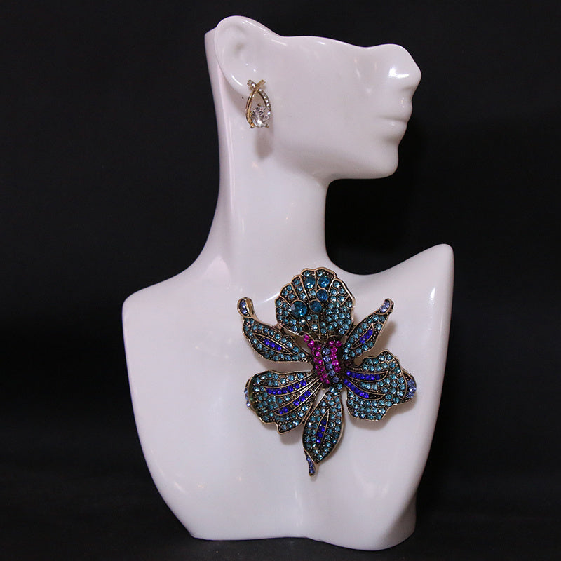 Women’s Gold Tone Baroque Flower Brooch with Rhinestones