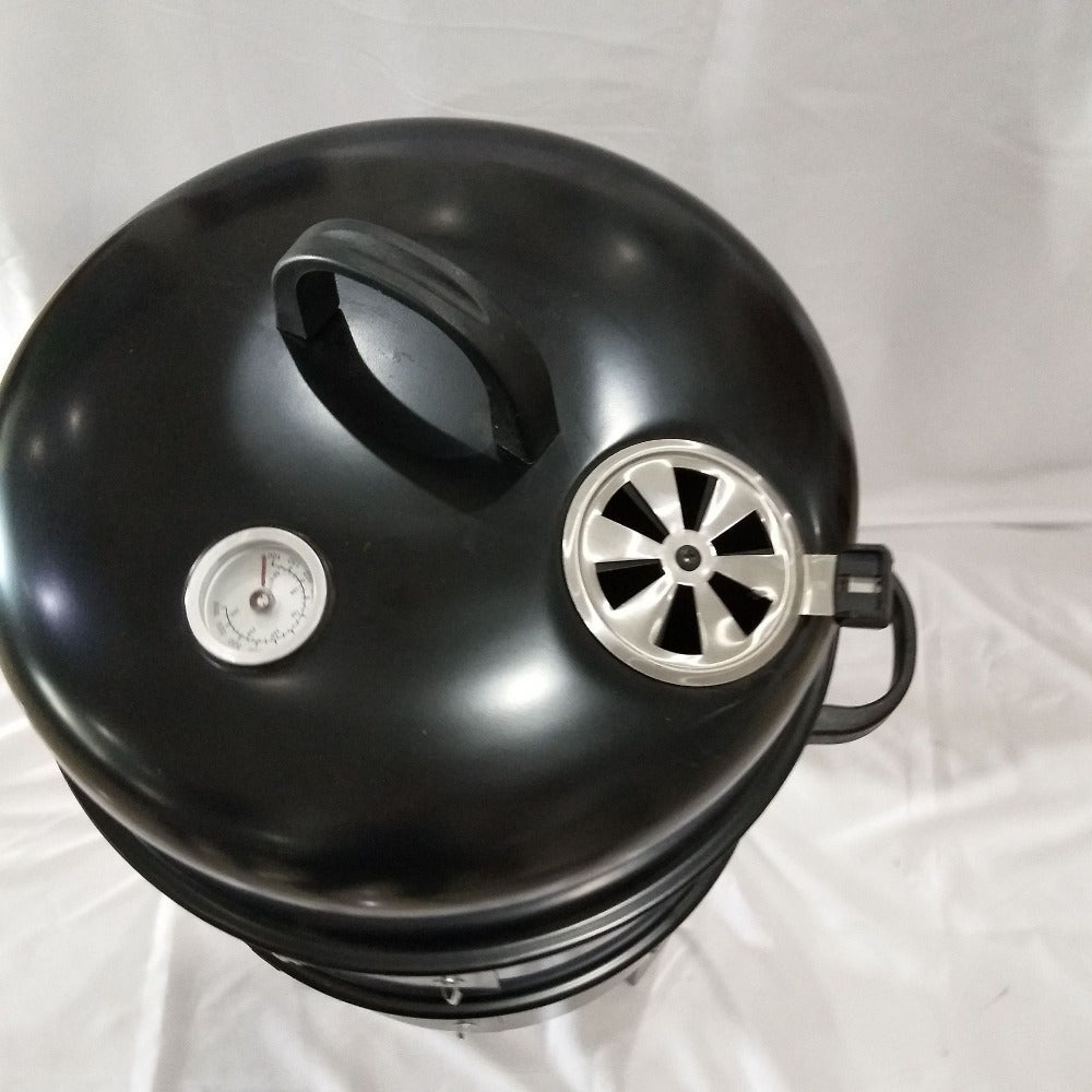 Portable outdoor BBQ grill and smoker with foldable design, integrated smoker box, ideal for camping and tailgating, insulated structure