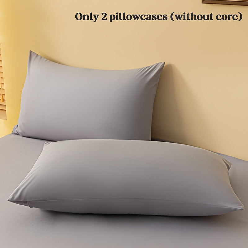 2 ta yostiq qopqog'i, bir rangda, yumshoq va qulay polyester materialidan tayyorlangan, konvert yopilishi bilan, yuvish mashinasida tozalash oson, 90gsm, yotoqxona, mehmonxona yoki mehmonxona to'shagi uchun ideal.