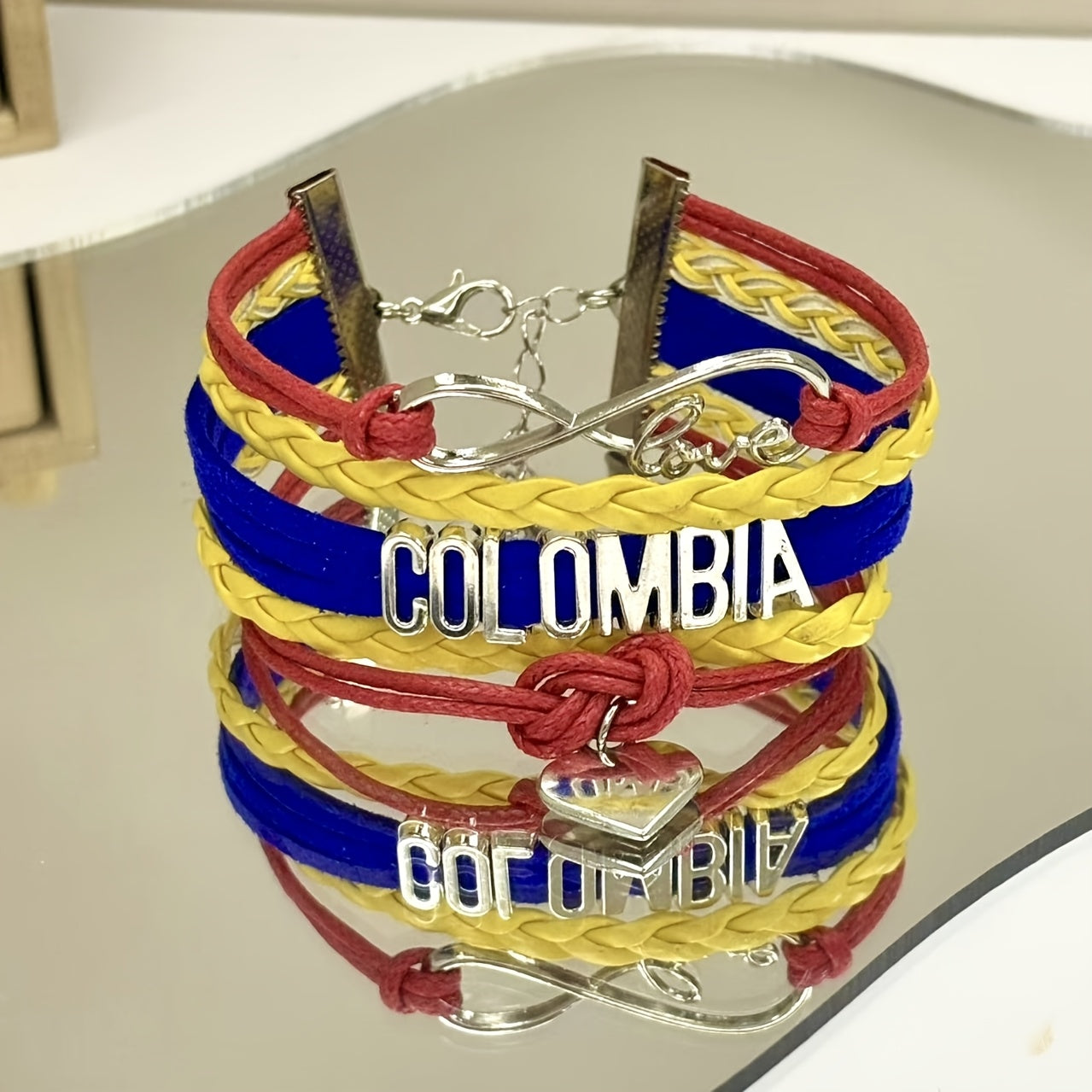 Pulsera elegante de aleación Colombia Love Weaving con diseño de logo Love