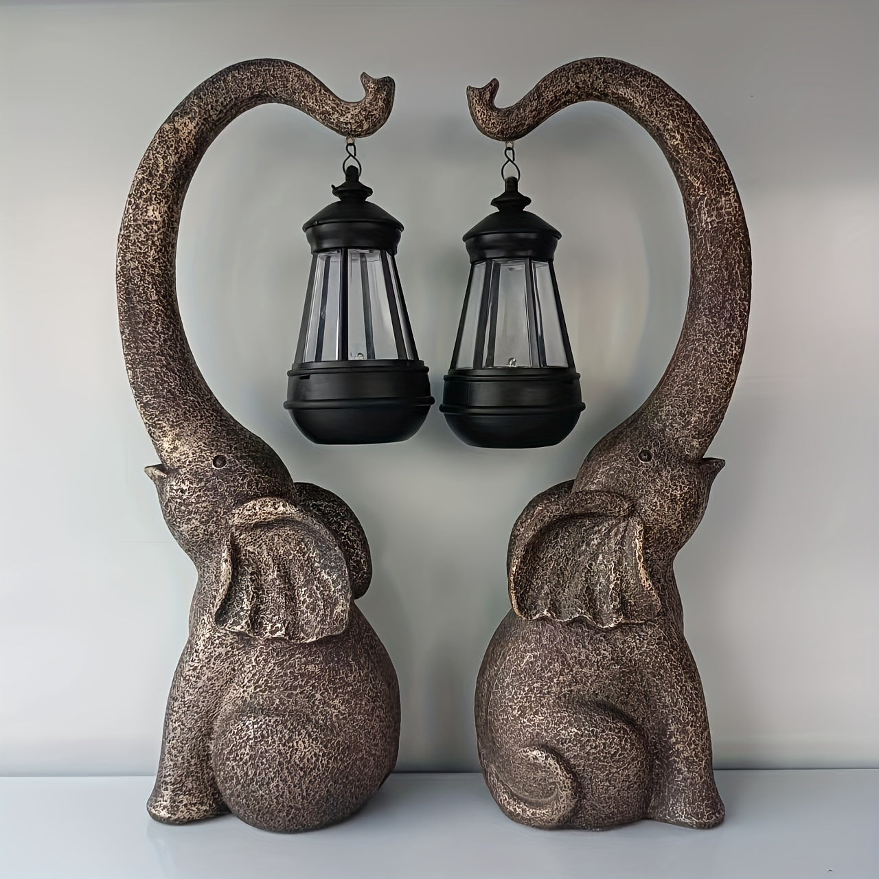 Solar-Powered Elephant Garden Lights Rustic Resin Outdoor Sculpture with Black Metal Lanterns
