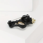 Broche negro mate con corona de rhinestones, accesorio de joyería