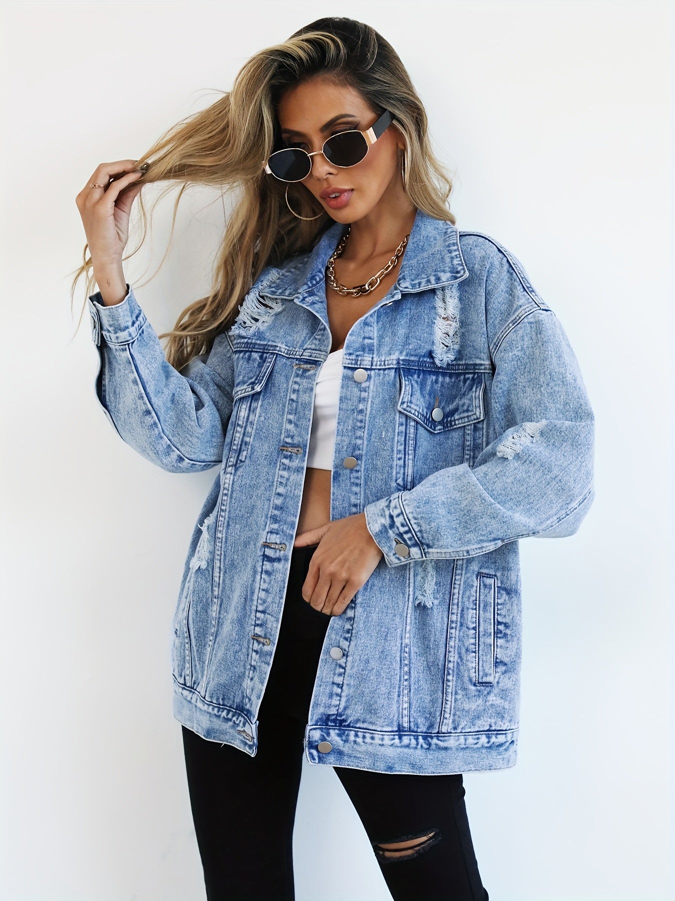 Women’s Light Blue Denim Jacket with Ripped Detailing and Long Sleeves