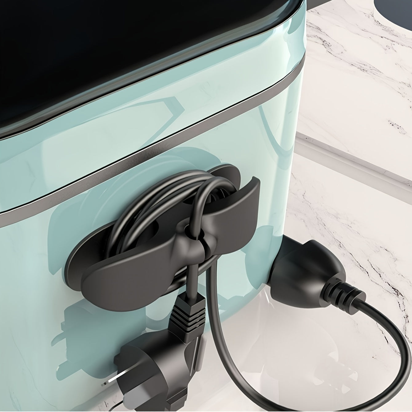 Ova shaklidagi plastik sim tutqich, oshxona texnikasi kabellarini tartibga solish uchun sovun idishi bilan