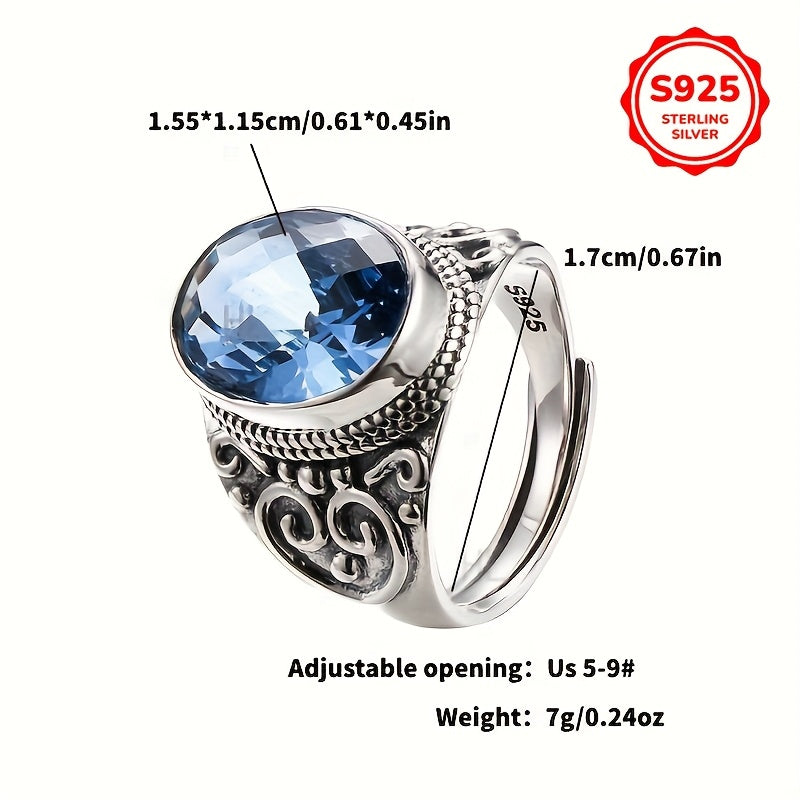 Vintage Style Sterling Silver Ring with Blue Zirconia and Carved Flower Design