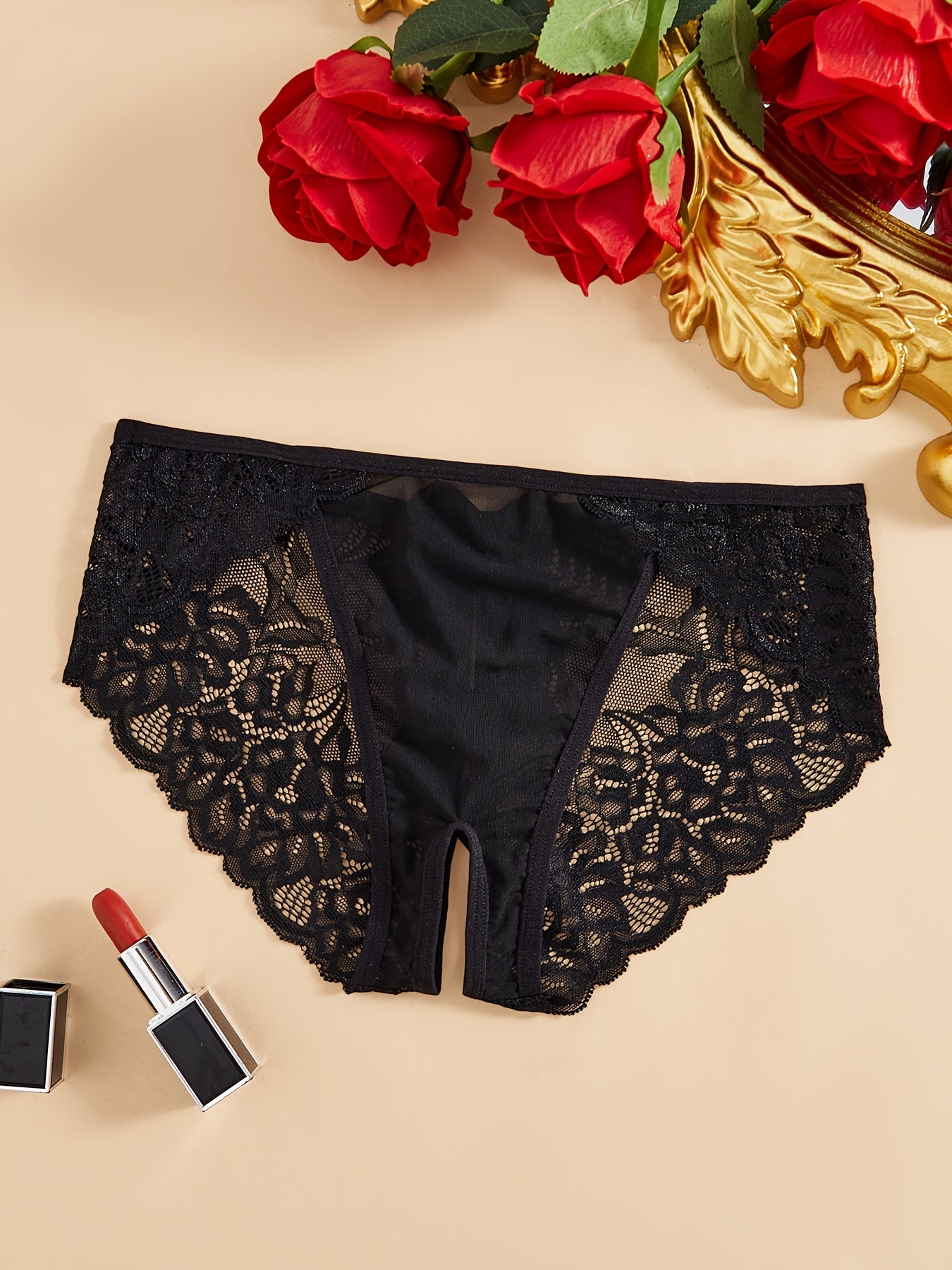 Трусики с низкой талией и украшением в виде банта, с открытым промежностью, из нейлона и полиэстера