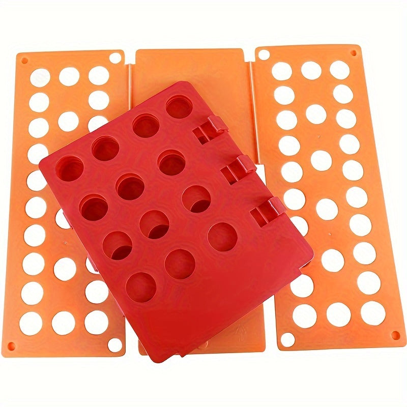 Kiyim-kechaklarni tashkil etuvchi yigʻish taxtasi T-shirtlar, shimlar, kiyinganlar, sochiqlar uchun, apelsin rang