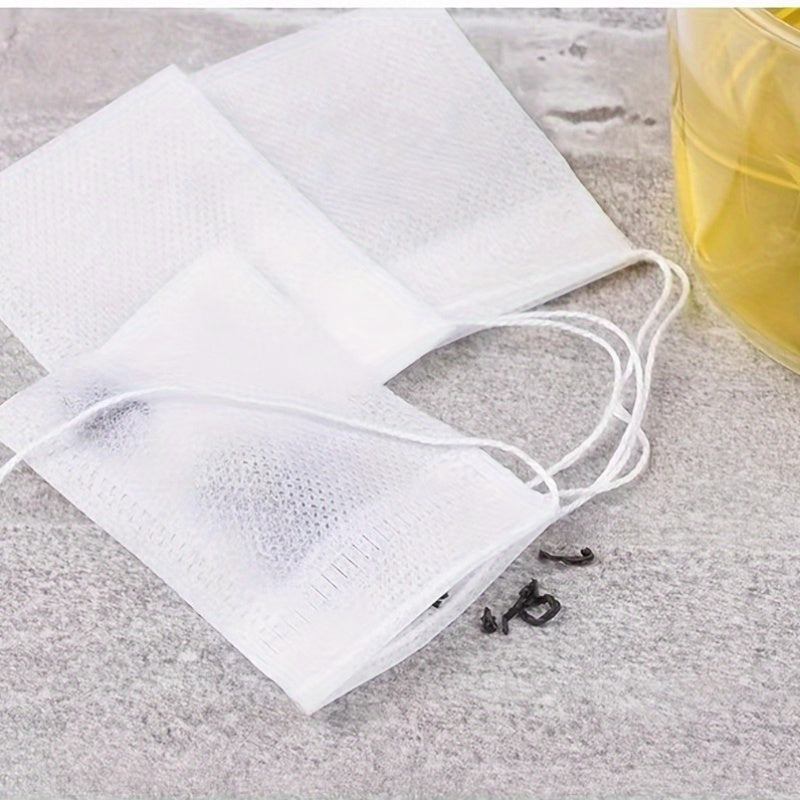 100 Pieces Disposable Plastic Tea Filter Bags with Drawstring for Loose Leaf Herbs and Spices