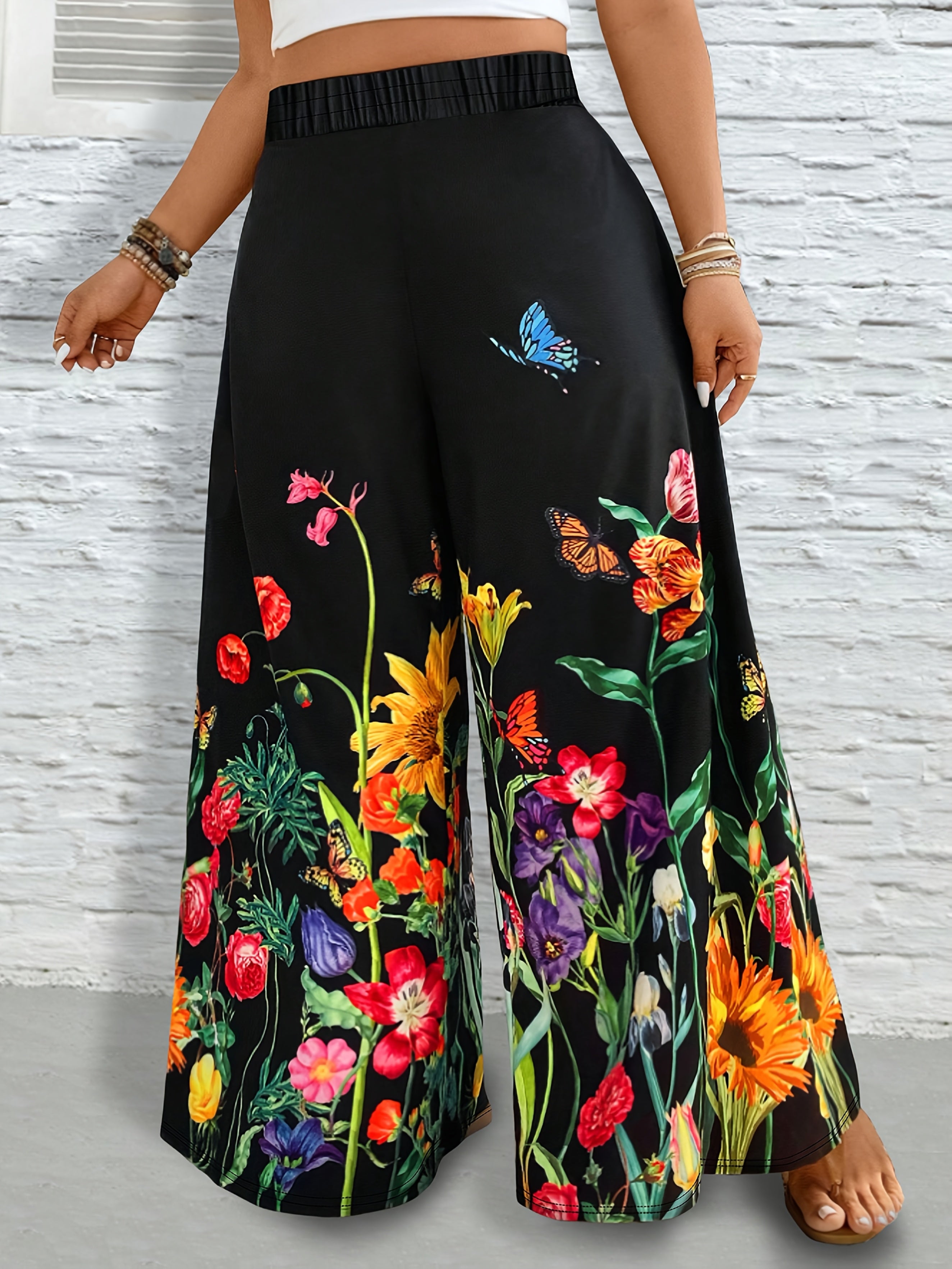 Pantalones de mujer de talla grande con pierna ancha y estampado floral negro vibrante, casual