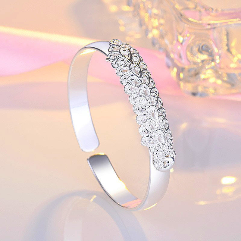 Women’s Ethnic-Inspired Bracelet with Peacock Feather Silk Opening and Phoenix Design