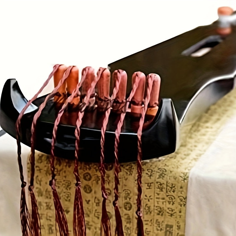 Guqin tradicional chino hecho de madera sólida de paulownia con acabado negro y clavijas de afinación doradas para principiantes