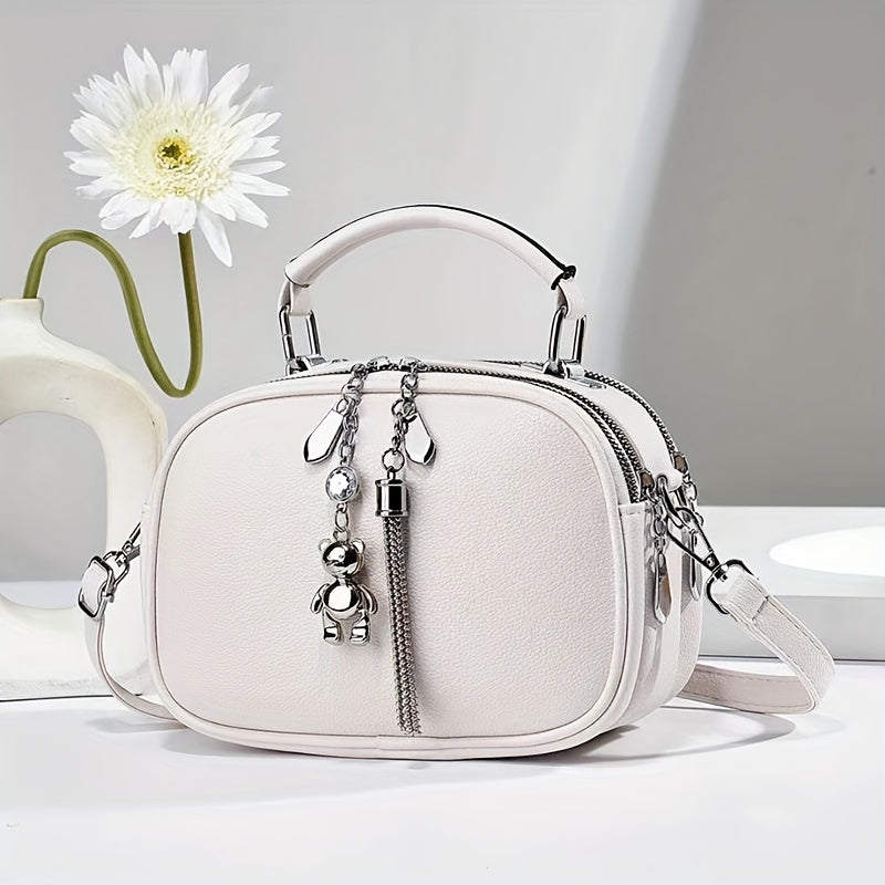 Black Mini Crossbody Bag with Bear Tassel and Multiple Compartments