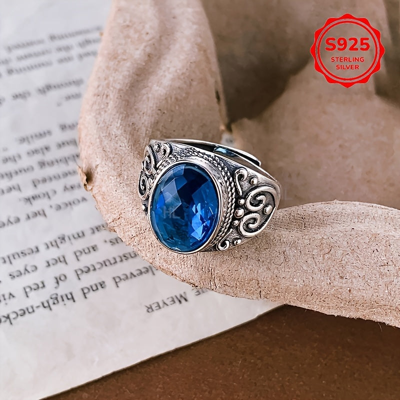 Vintage Style Sterling Silver Ring with Blue Zirconia and Carved Flower Design