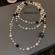 Vintage-Inspired Long Chain Necklace with Faux Pearls and Multilayered Design