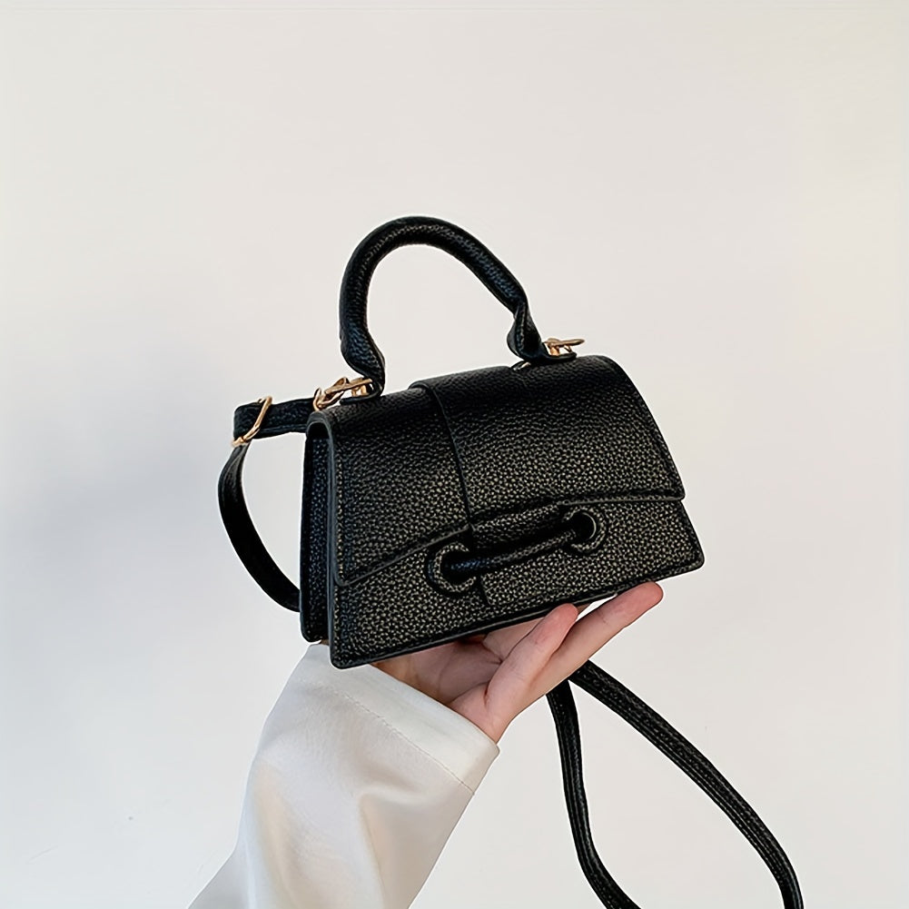 Zamonaviy niş dizayni, yuqori tutqichi va kvadrat shakli bilan uslubiy mini crossbody sumka.