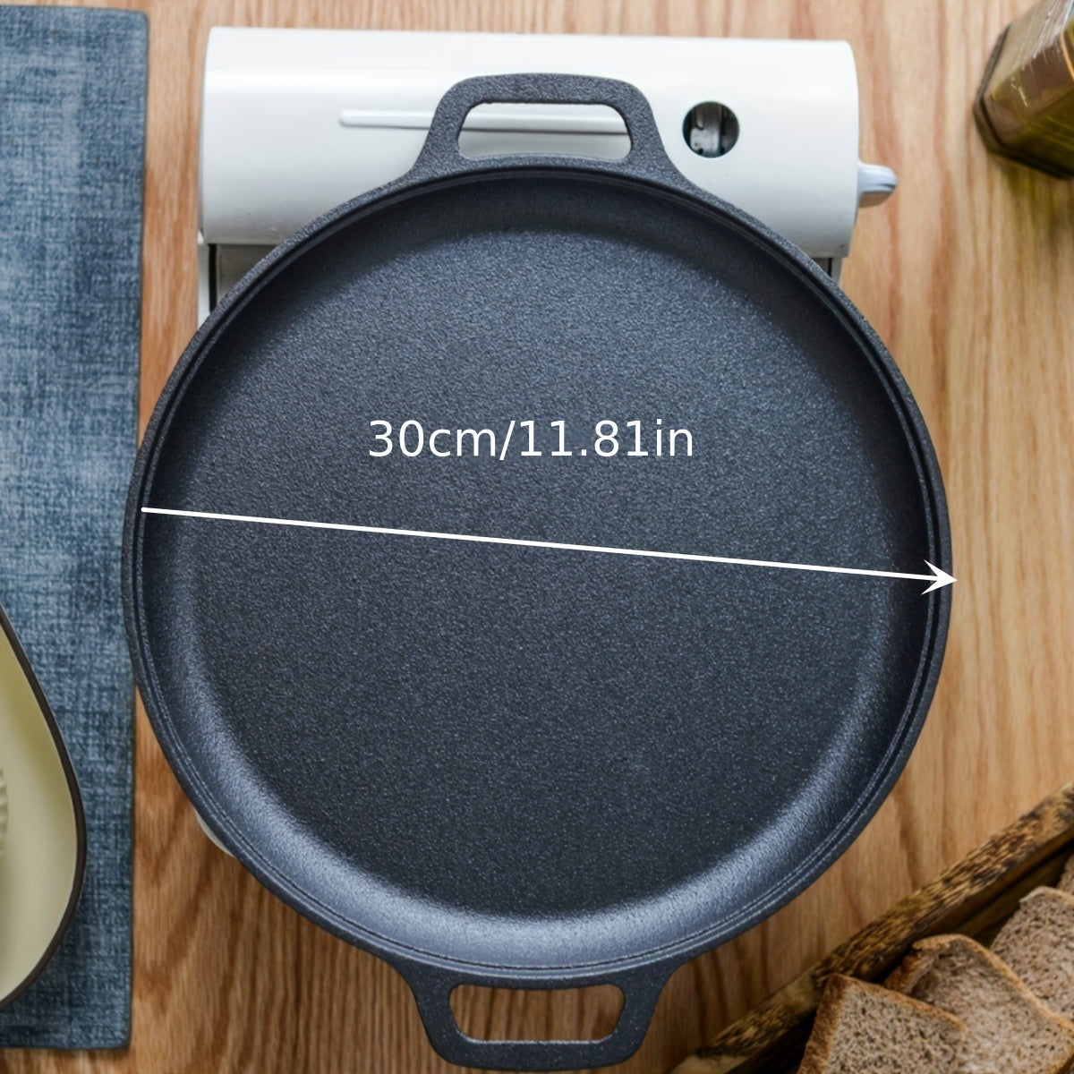 "Oldindan tayyorlangan, ikki tutqichli, 30 sm o'lchamdagi yopishqoq temir qozon - pancake, gril qilish va qovurish uchun ideal - faqat qo'lda yuvish"