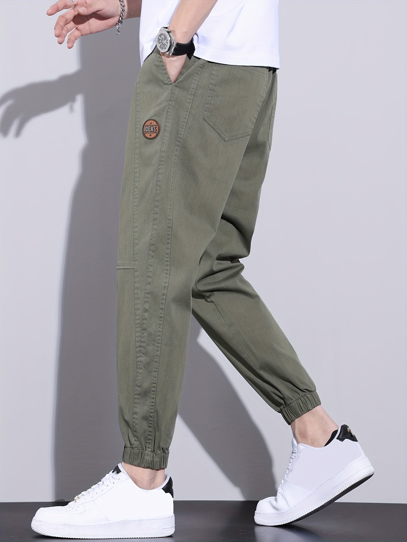 Erkaklar uchun tasodifiy joggerlar - bo'sh kesim, tortish ipi bilan, paxta aralashmasi, barcha mavsumlar uchun ko'p funksiyali va zamonaviy.