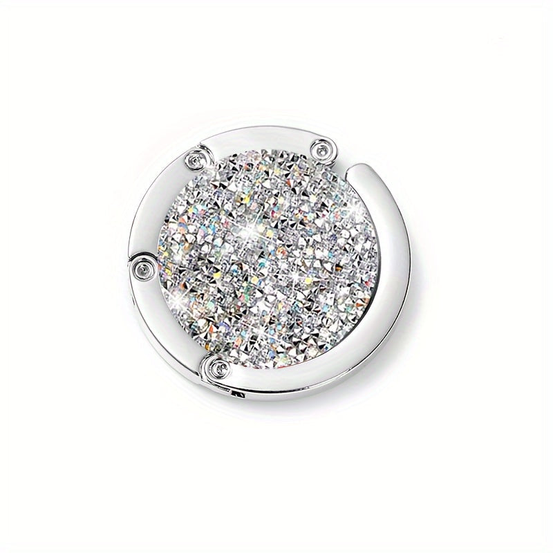 Oq oltin rangli, suv olmosi bilan bezatilgan, harakatda olib yurish uchun mukammal bo'lgan egiluvchan tutqich. Kundalik safarlar, yig'ilishlar, bayramlar va o'ylangan bayram sovg'asi uchun ideal.