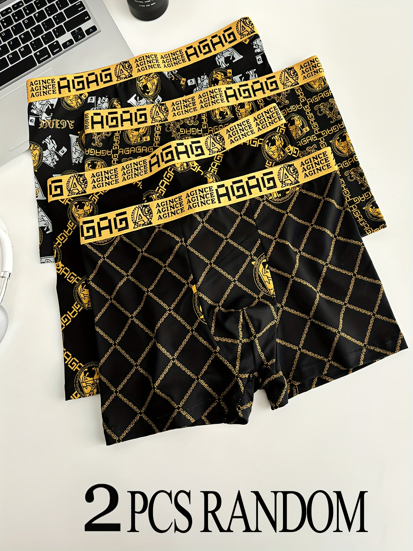 2-Pack erkaklar uchun boxer shortlari, oltin bosma bilan, 95% polyester va 5% spandeksdan tayyorlangan. Elastik to'qilgan mato, geometrik naqsh va nafas oladigan, tez quriydigan material bilan ta'minlangan, kundalik foydalanish uchun mustahkam.