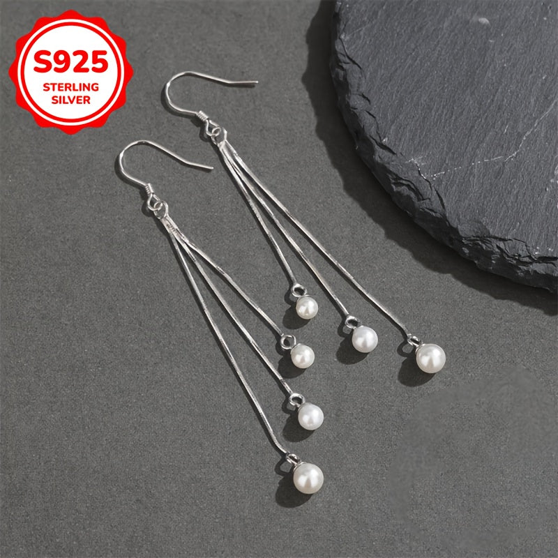 Silliq va zamonaviy, bu S925 Sterling Silver sirg'alar uzun tassellarga va shirin suv marvaridlariga ega. Gippoallergen va 2G og'irlikda yengil, ular ayollar uchun har kuni kiyish uchun ideal va ajoyib Onalar kuni sovg'asi bo'ladi.